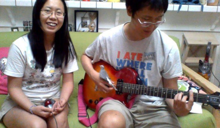 When working in a big company, my life was carefree, I even had time to learn the guitar! This is a picture of me practicing it with my pet dove standing on my hand