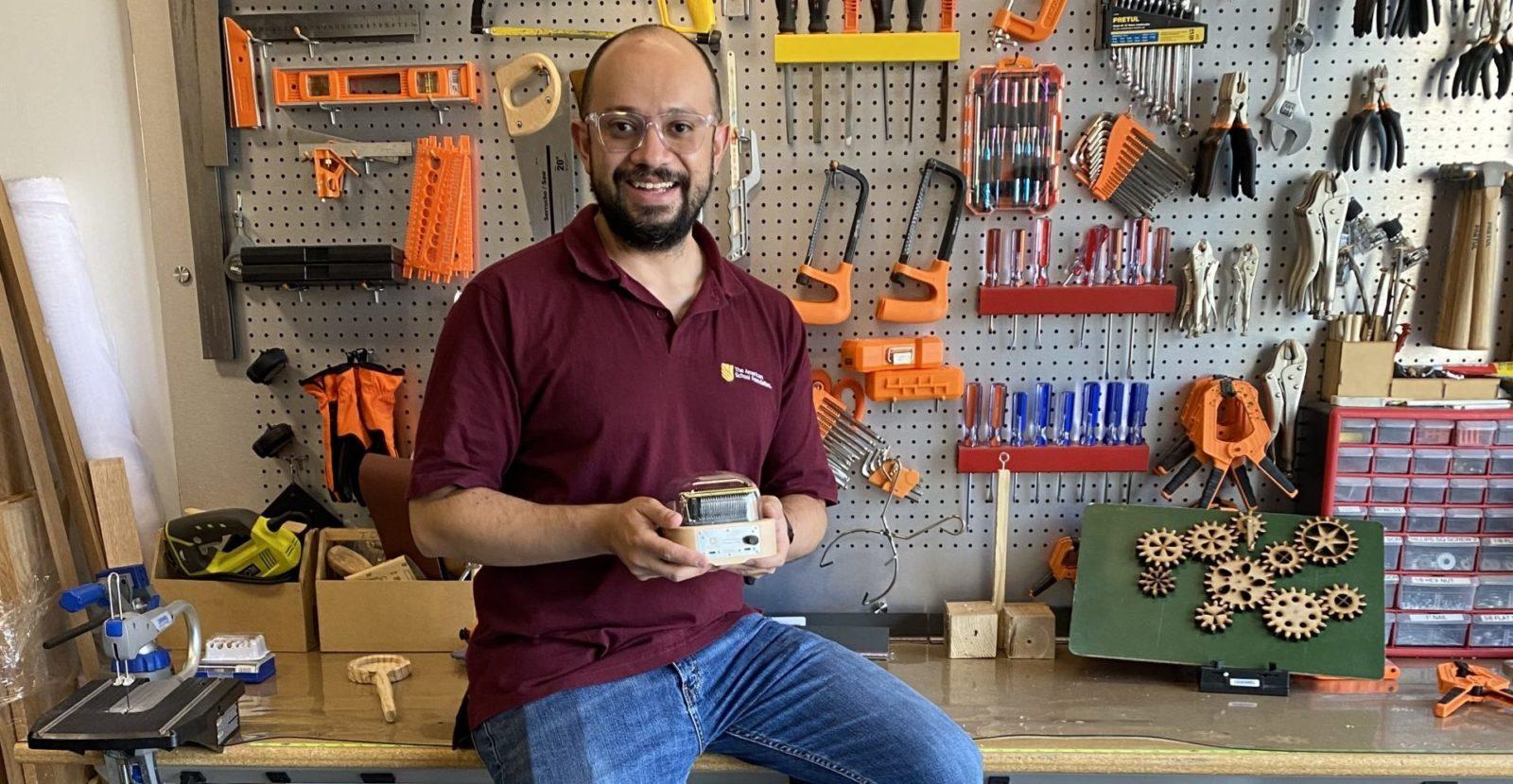 Mexico educational user of Muro Box, holding a Muro Box in his maker space