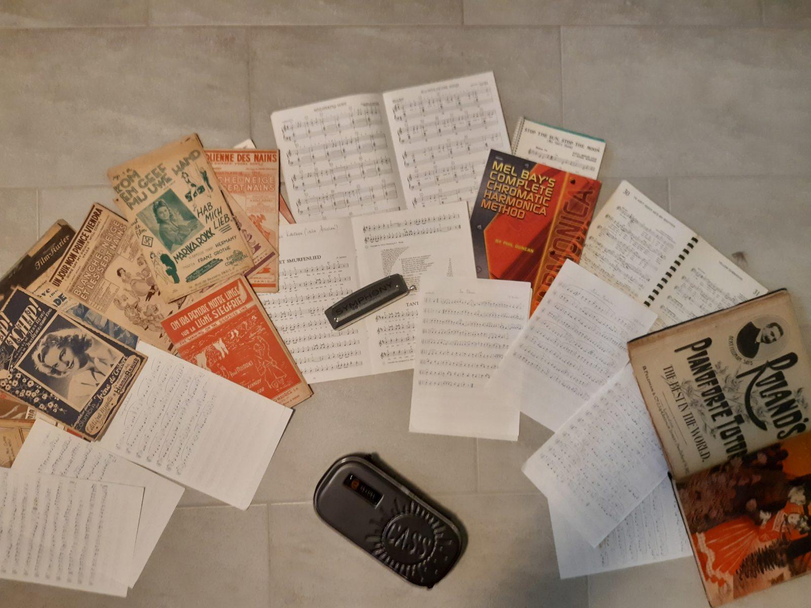 My harmonica + music sheets. Some old and new ones