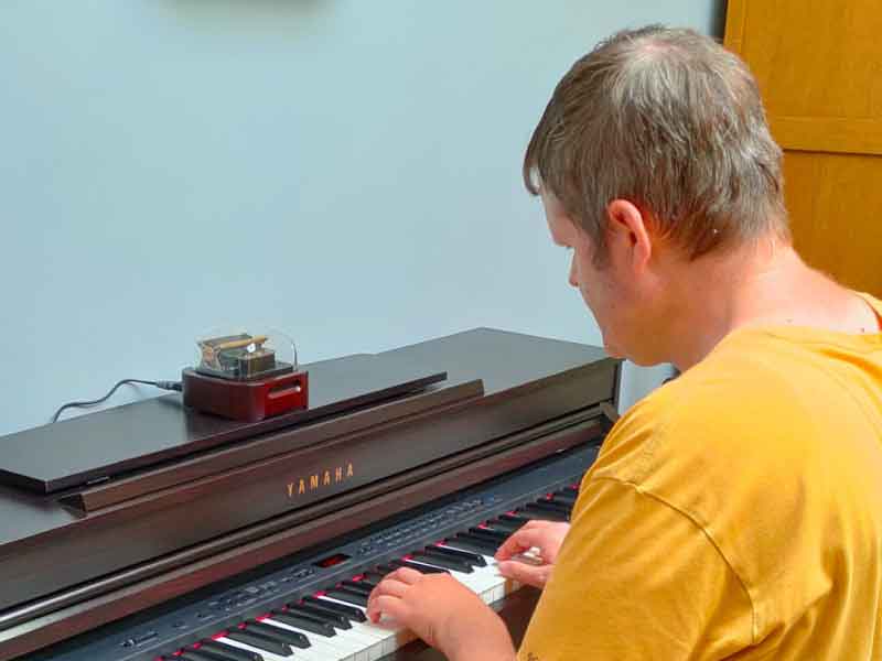 This is Geert from Belgium. On his Yamaha keyboard sits the N20 Standard model music box, released during the early Indiegogo crowdfunding campaign.